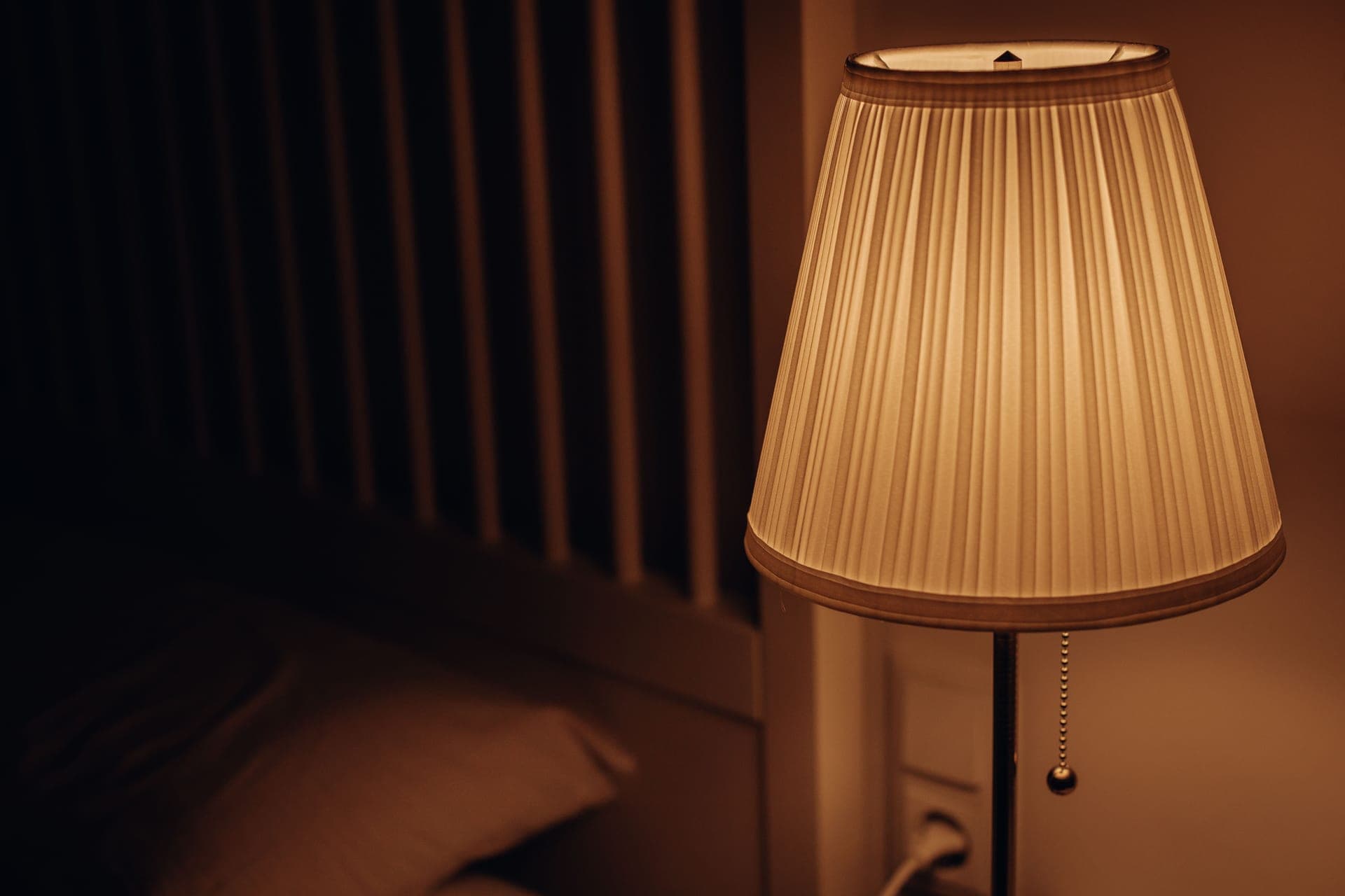 Warm evening light across a quiet dressing-table surface